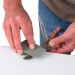 Click For Bigger Image: Trend DWS/KIT/C Credit Card Stone sharpening a pair of scissors.