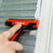 Click For Bigger Image: Scraping paint off Glass with Timco Tile and Glass Scraper.